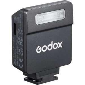 Godox iM22 compact mini flash mounted on a camera hot shoe for portable photography lighting.